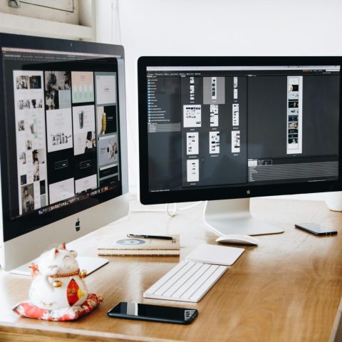 pexels-photo-326503-326503 A well-organized design workspace with dual monitors and design software on display.